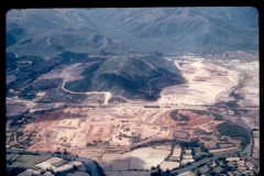 A part of the Qui Nhon logistical complex is shown in this photograph. This site is actually located Route 19 west of Qui Nhon and will consist of three sub-areas. The first, located in the fore ground of the photograph, will be a storage area for Engineer class IV supplies. The second, located in the upper right hand portion of the photograph will be an engineer field maintenance depot. The third, located in the upper right hand portion of the photograph will be a cantonment for the personnel who will work here. Since February some 10,000 cy of fill have been hauled, a number of concrete pads have been placed in the cantonment area and the construction of the first maintenance building has been started.