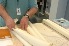 Peter Alex does an initial inventory of maps from an Army Corps of Engineers project in Kirwan, Ohio.